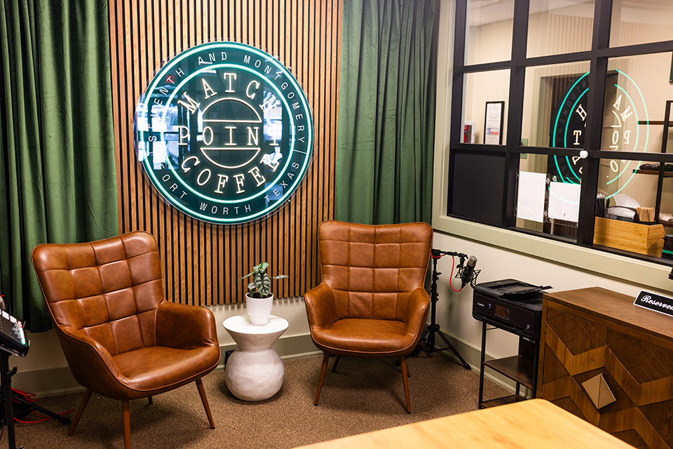 A cozy nook with two chairs at Match Point Coffee