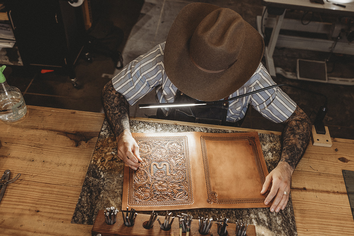 Clint Wilkinson works on leather