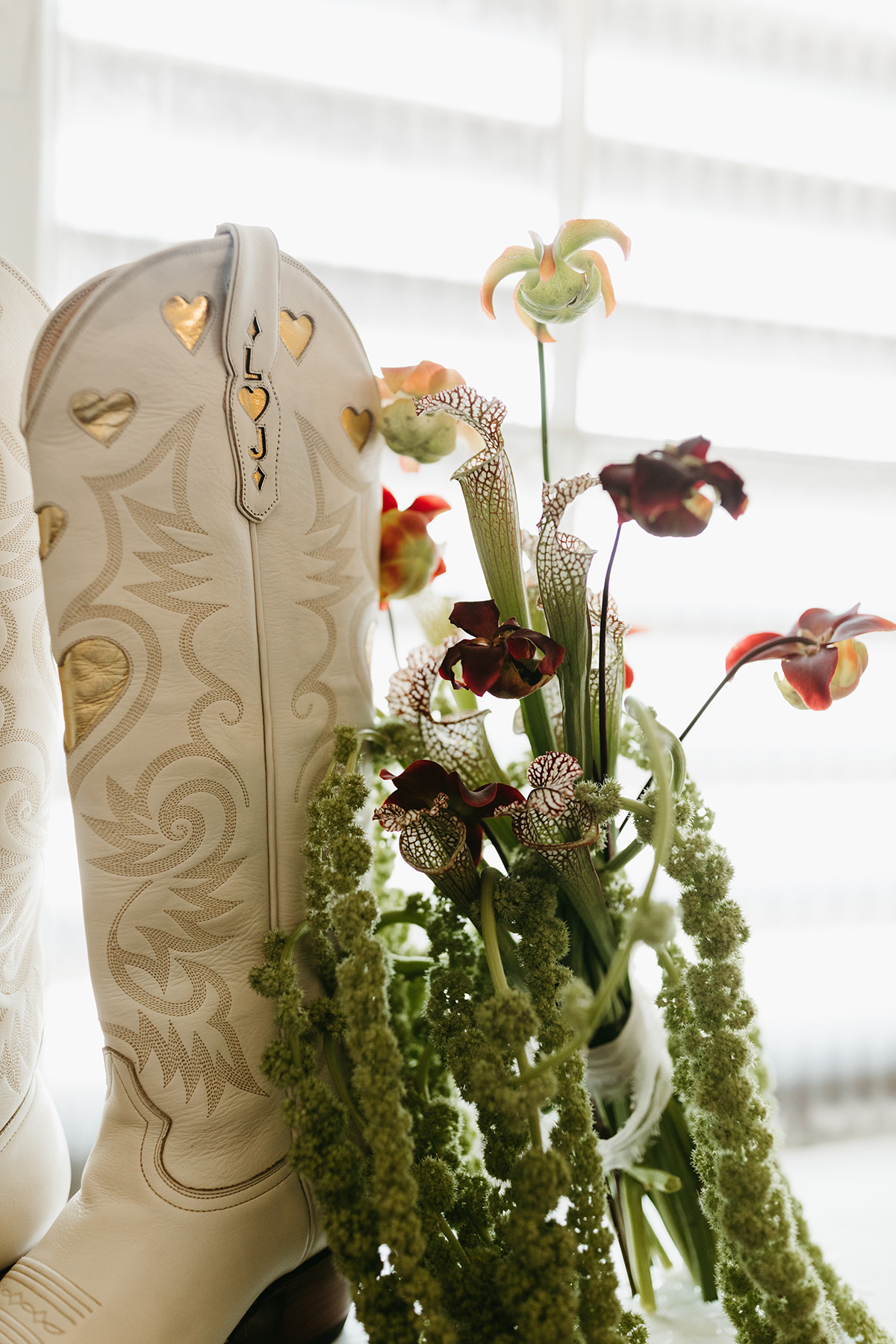 Leah and Jake's boots and bouquet