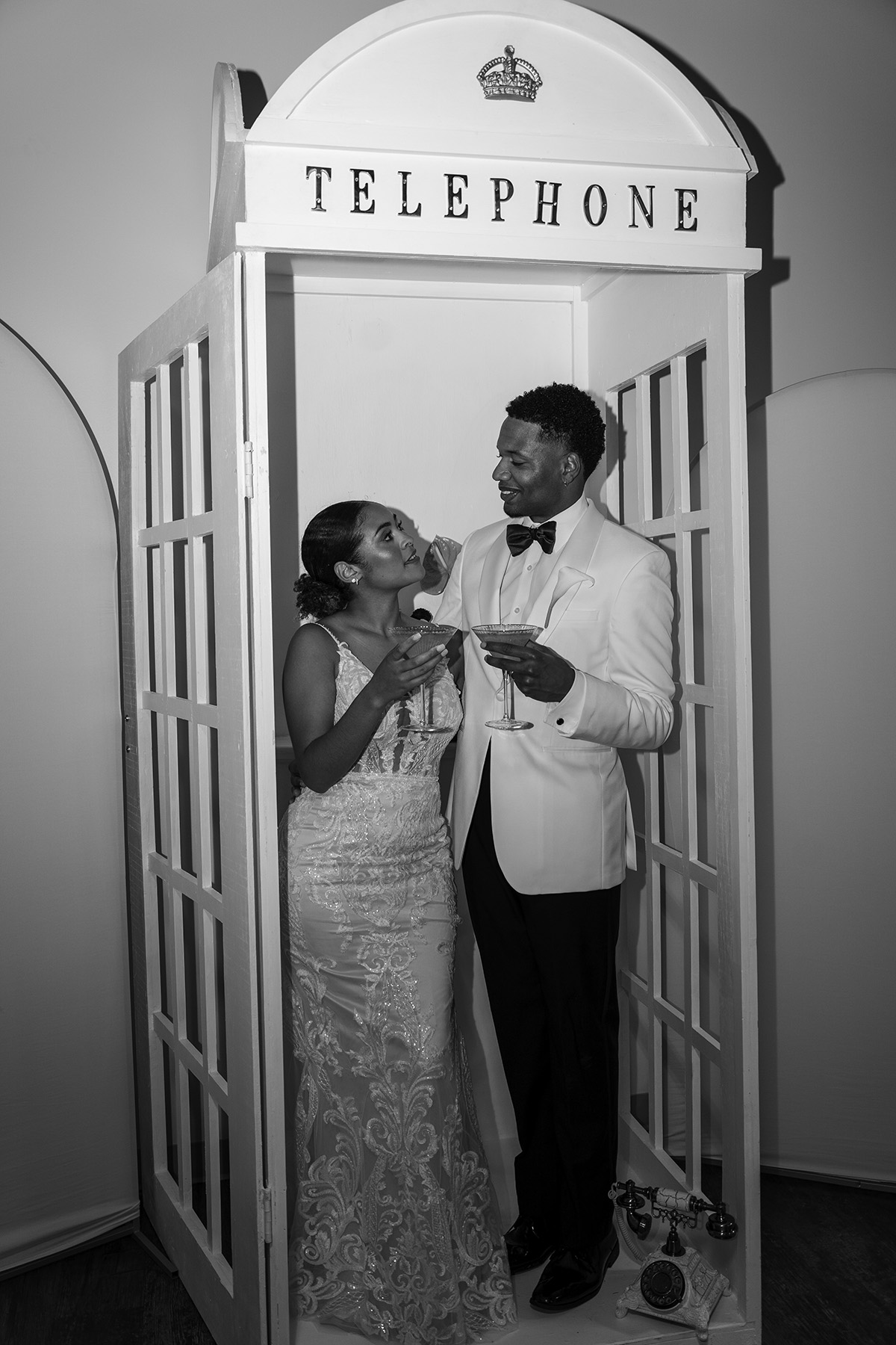 Wedding couple in a telephone booth