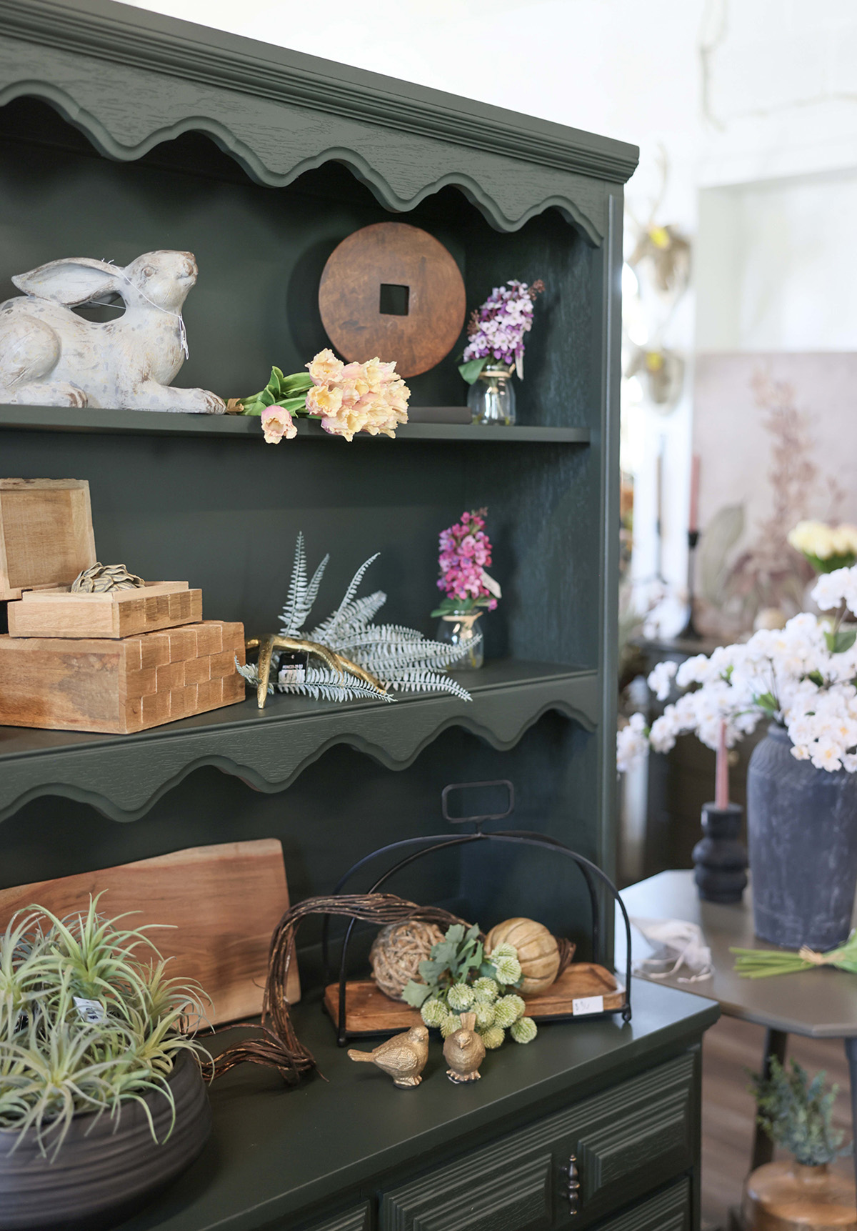Decor atop a refinished shelf at RQ Designs