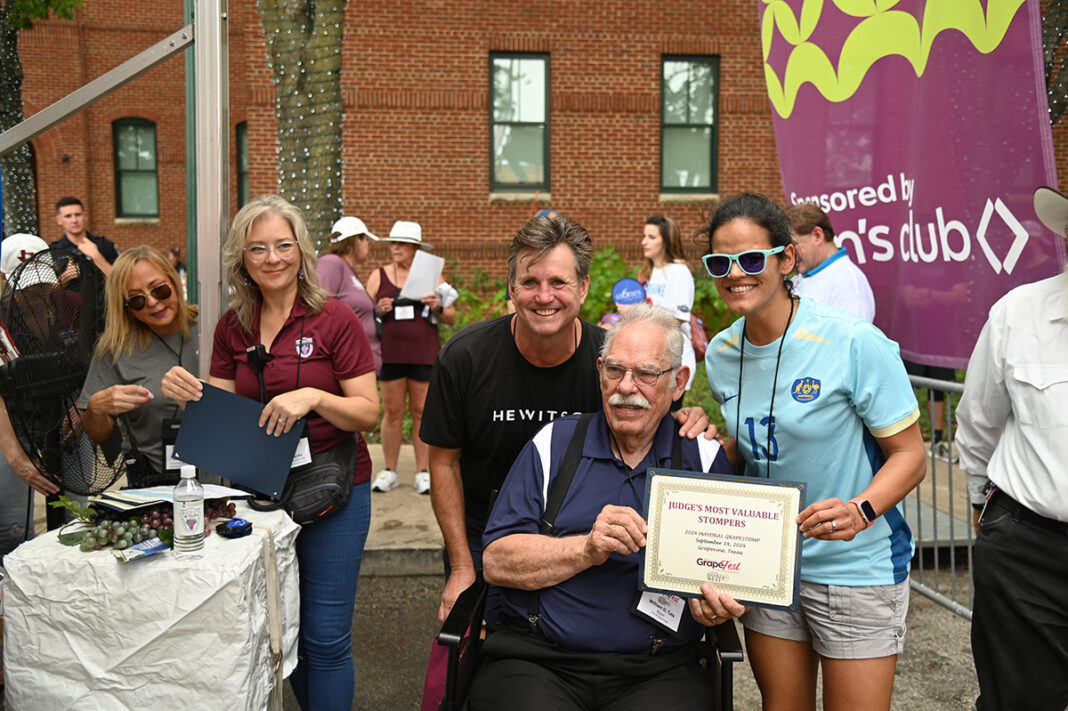 William D. Tate presents a certificate at the GrapeFest celebration