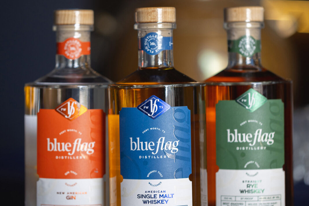 Bottles of Blue Flag Distillery's gin and whiskey